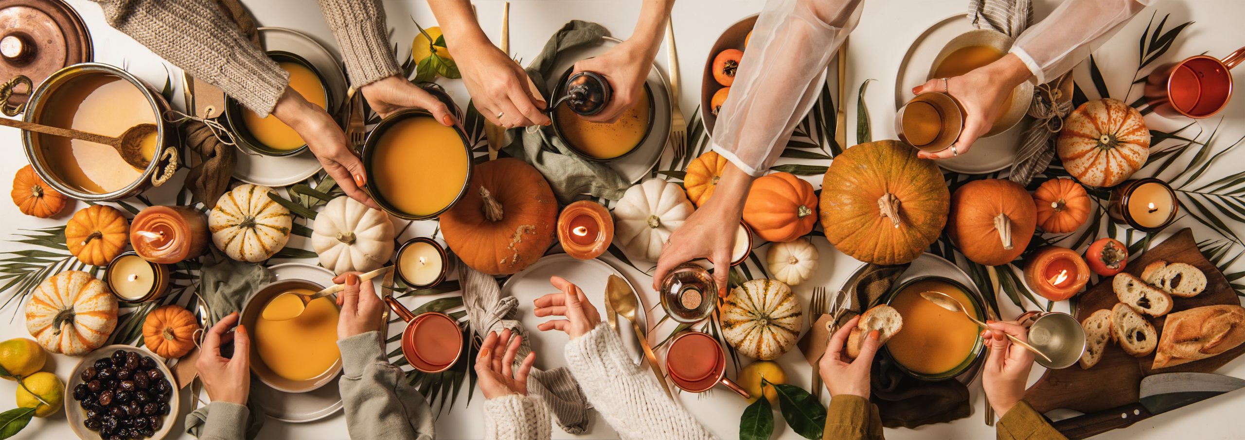 Family eating at Thanksgiving celebration party table