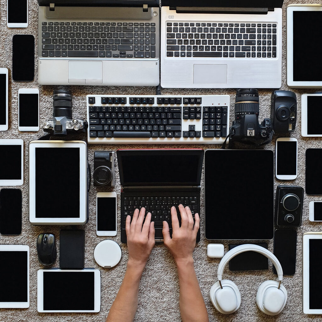 Someone surrounded by technology to inventory