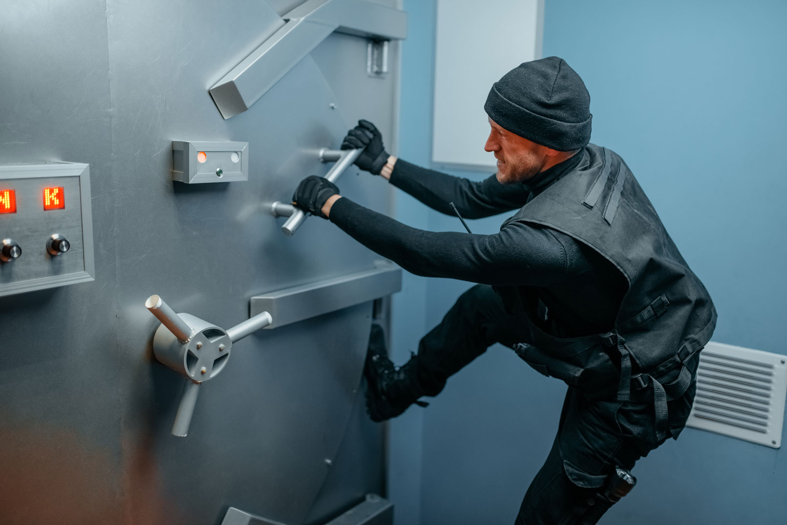 Feature image robber trying to break into bank vault